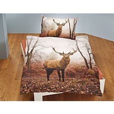 Linge de lit avec cerf dans une forêt
