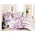 Linge de lit avec motif fleuri violet sur fond blanc