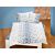 Linge de lit orné d'une belle broderie à motif floral